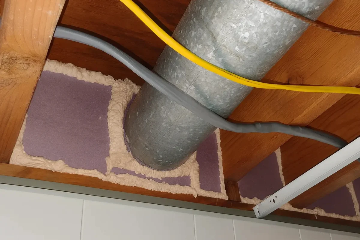 flexible hvac duct running through an insulated attic space, showing an area typically addressed during duct sealing work in baltimore md