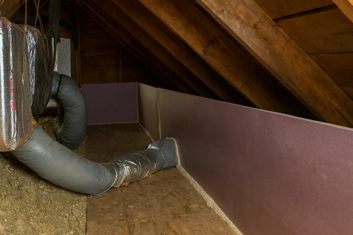 hvac duct connection sealed and routed through an attic knee wall, illustrating duct sealing work in baltimore md