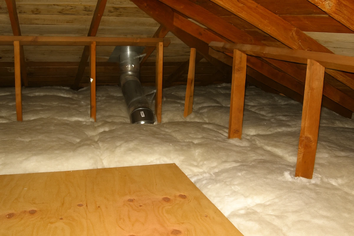 attic filled with fresh white insulation during a home insulation upgrade in baltimore md, showing improved energy efficiency and sealed ductwork